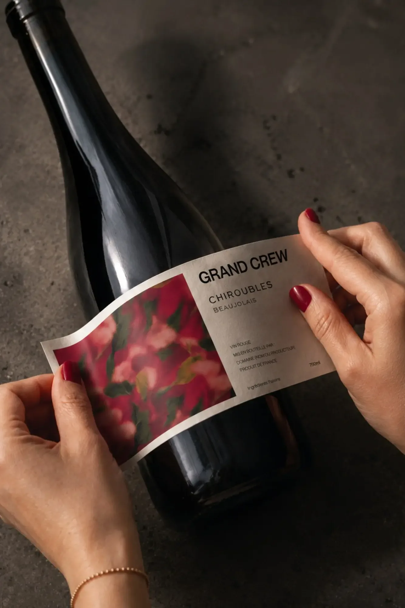 Grand Crew Chiroubles label being applied during production